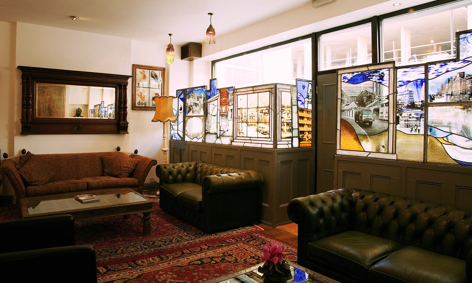 Painted glass windows in our upstairs lounge add warmth and atmosphere.