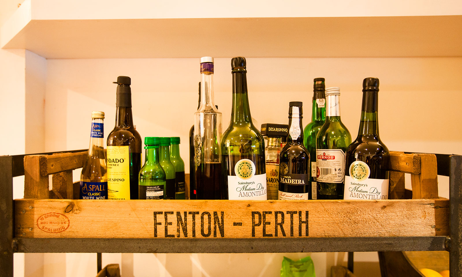 Spirits and vinegars on display in our kitchen.