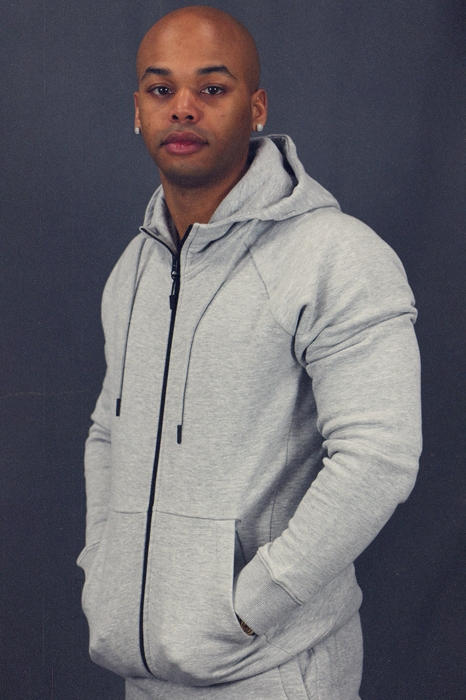 side view of the Men's Heather Grey Fleece Zip Up Hoodie Sweatshirt Jogger Top To Match Sneakers