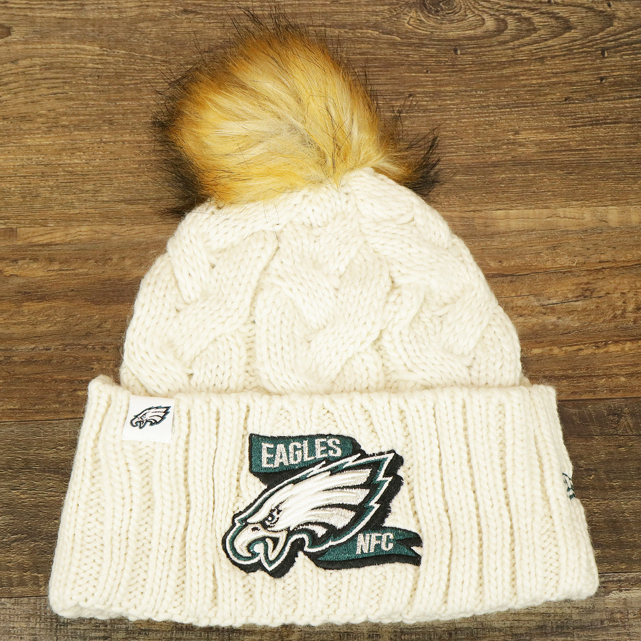 The Women’s Philadelphia Eagles 2022 NFC Cuffed Winter Knit Meeko Pom Pom Beanie | Women’s White Winter Beanies