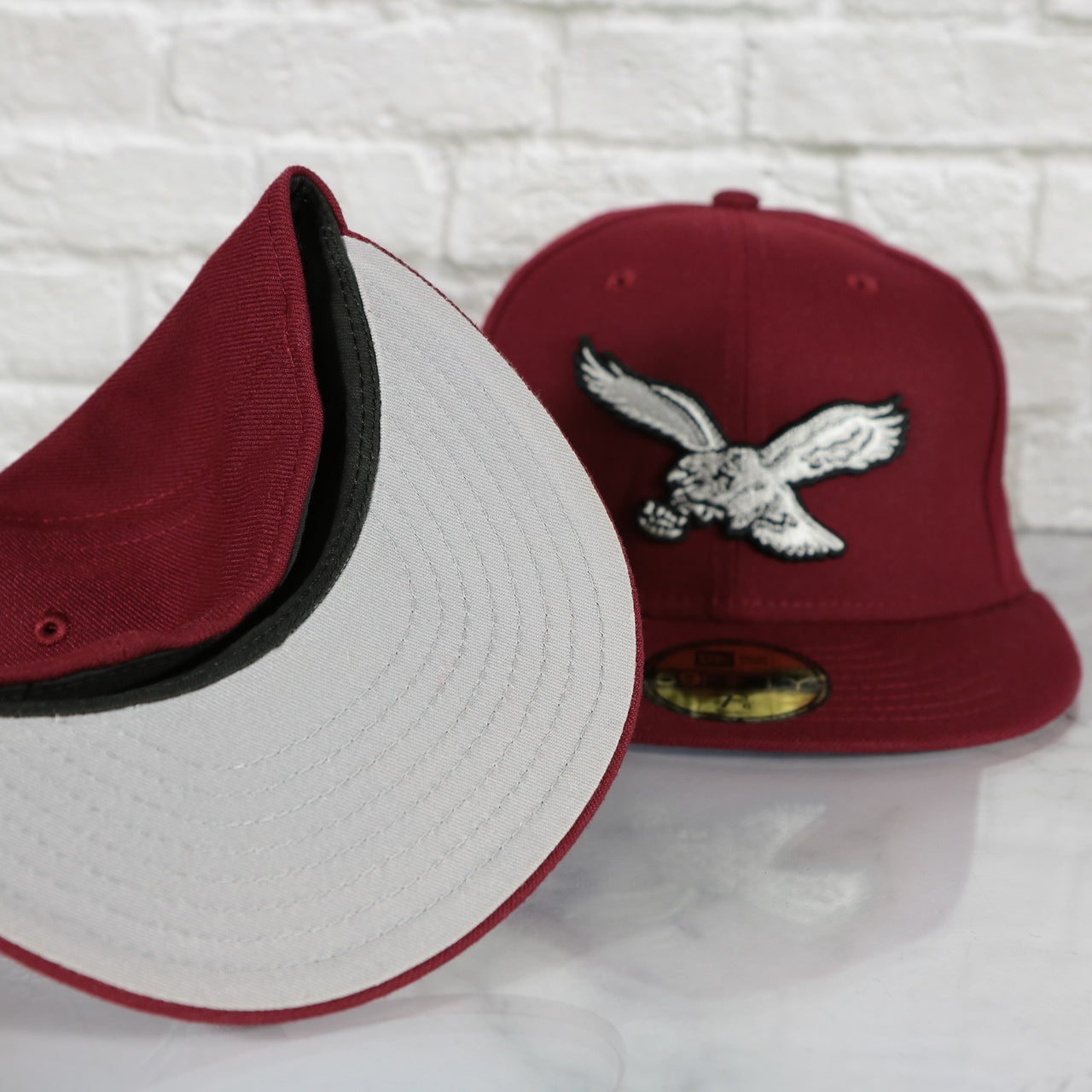 grey under visor on the Philadelphia Eagles Throwback Logo Retro Cooperstown Phillies Colorway Gray Bottom 59Fifty Fitted Cap