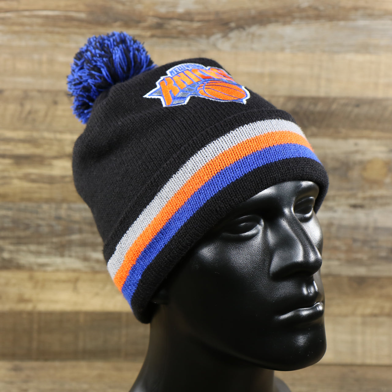 The New York Knicks Striped Cuff Black Out Blackout Knit WInter Beanie With Multi Colored Pom Pom | Black Winter Beanie