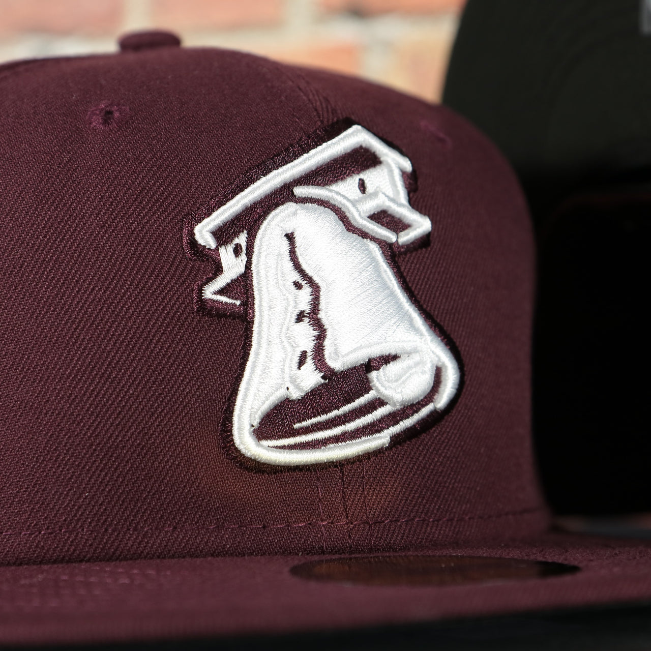 liberty bell ironpigs logo on the Lehigh Valley Ironpigs On Field Plain Jane 2014 Ironpigs Liberty Bell Logo MiLB Black Bottom | Maroon 59Fifty Fitted Cap