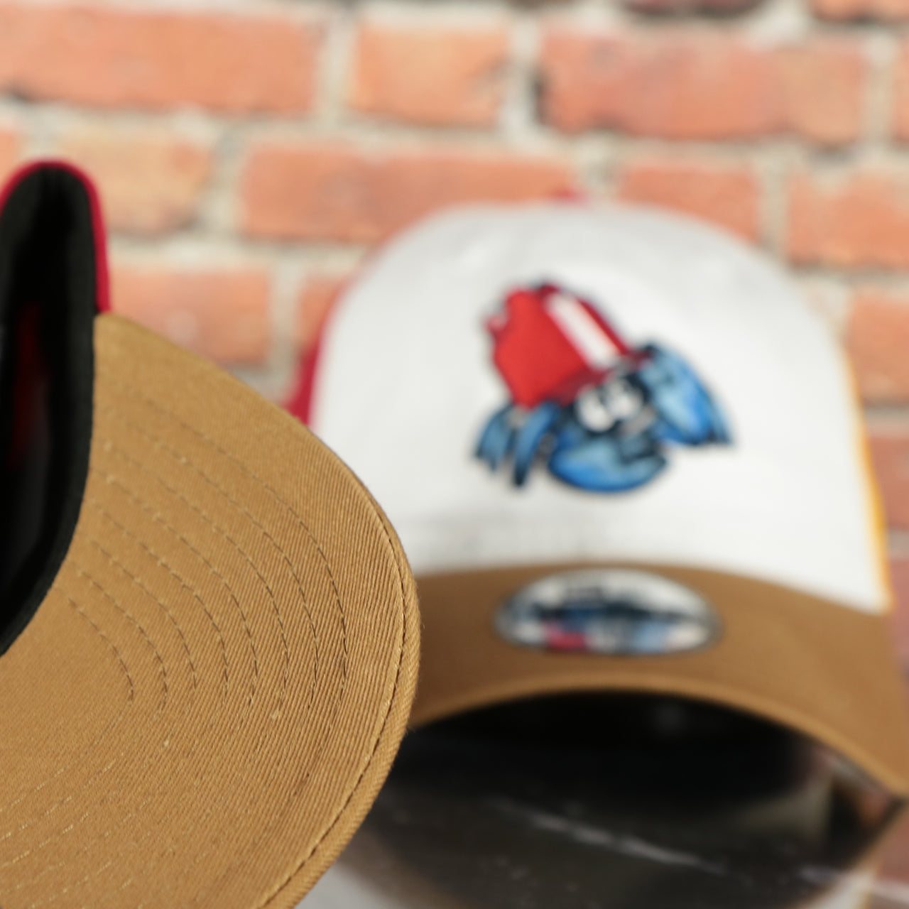 panama tan under visor on the Jersey Shore Blueclaws Bucket Blueclaw MiLB Tan bottom 4 Tone | White/Red/Tan/Royal 9Twenty Youth Dad Hat