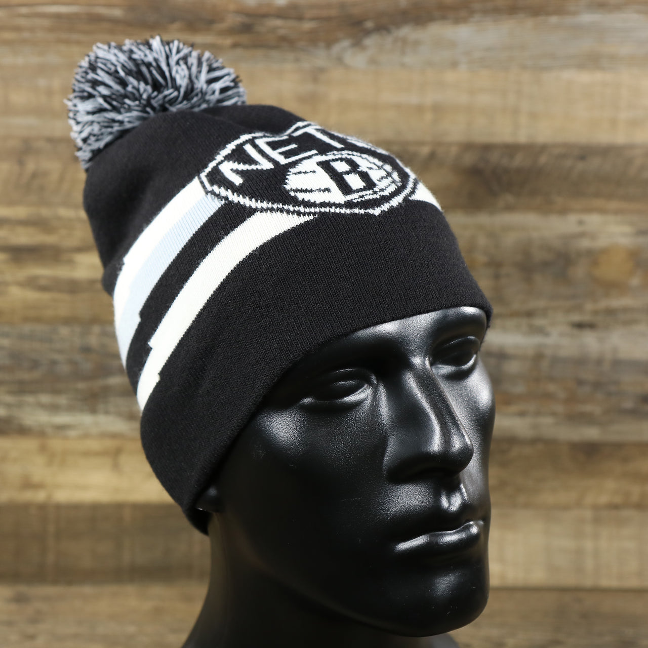 The Brooklyn Nets Cuffless Striped Winter Beanie With Pom Pom | Black, White, And Gray Beanie