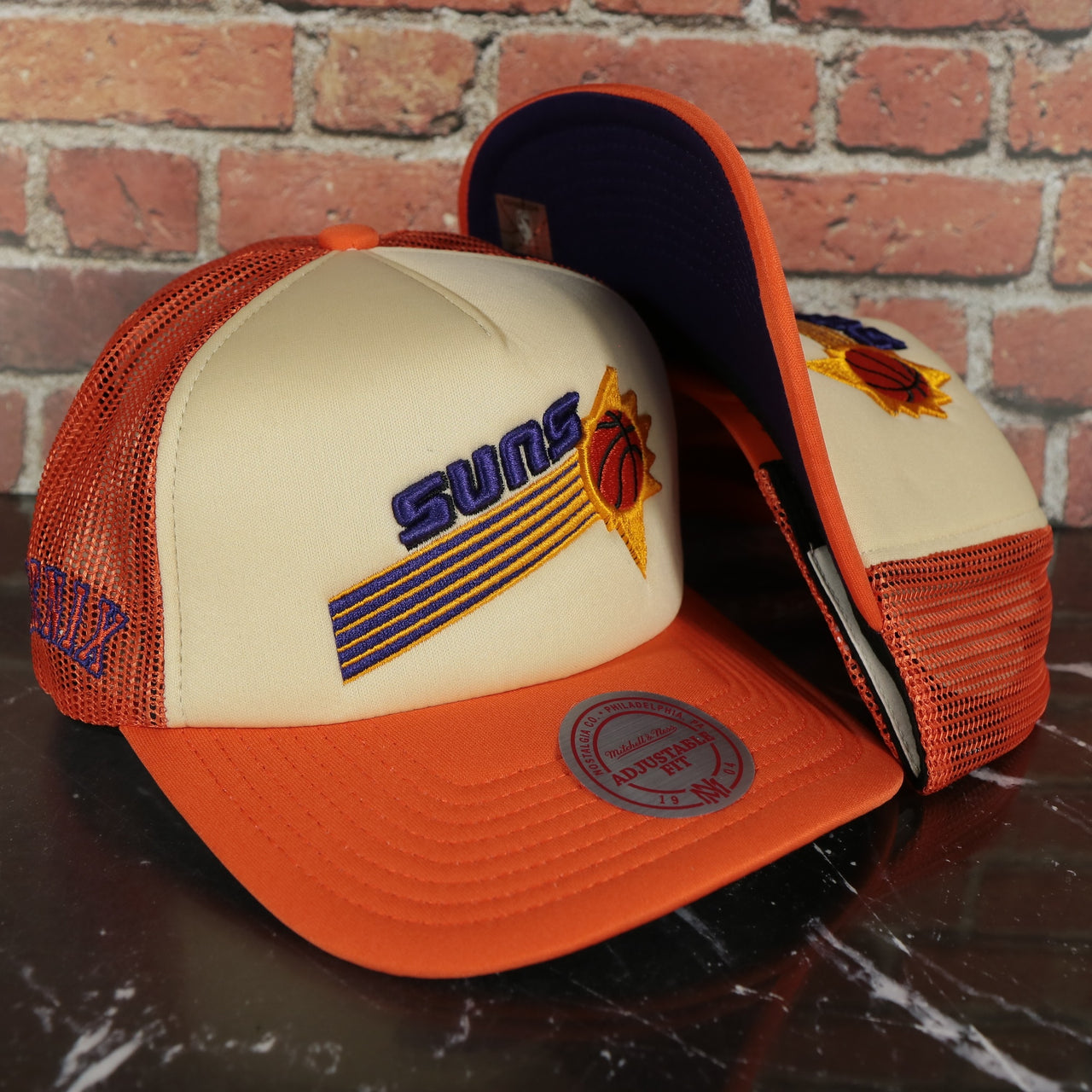 Phoenix Suns Vintage "Phoenix" wordmark Purple Bottom 2-Tone Foam Trucker Hat | Orange/Off-White Mitchell and Ness Hat