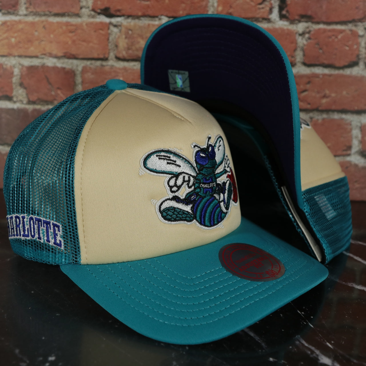 Charlotte Hornets Vintage "Charlotte" wordmark blue Bottom 2-Tone Foam Trucker Hat | Teal/Off-White Mitchell and Ness Hat