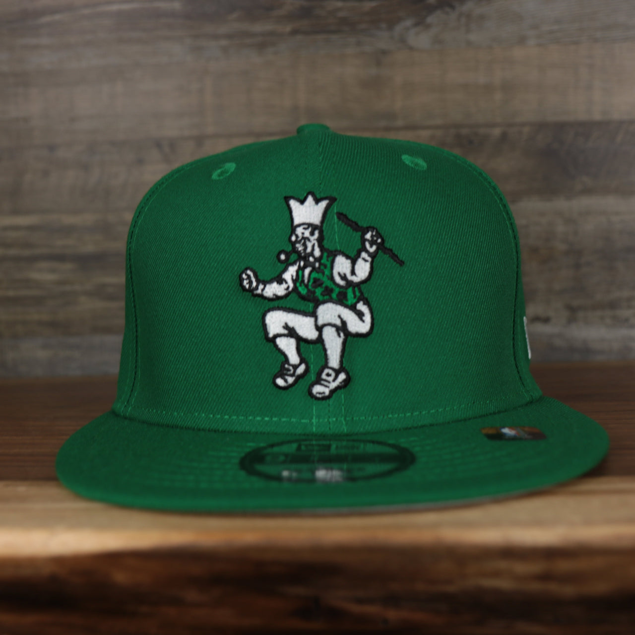 front of the Boston Celtics 2021 City Edition Vintage Grey Bottom 9Fifty Snapback | Green