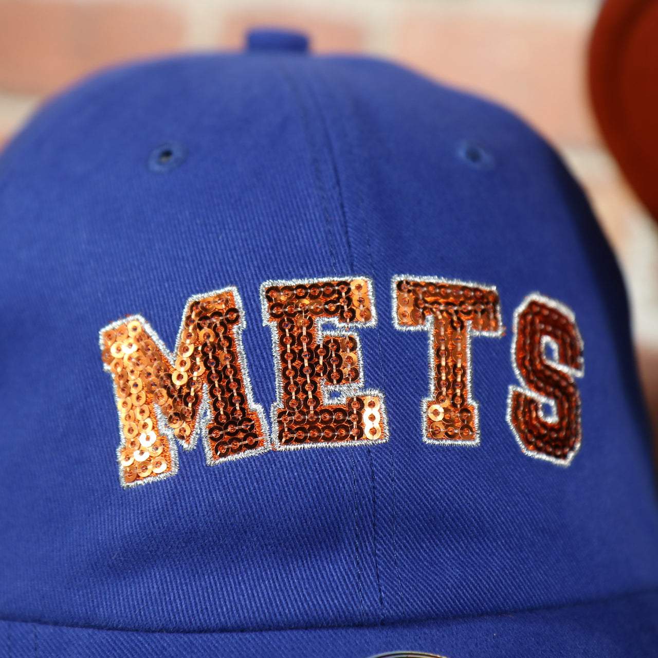 mets lettering on the New York Mets Sequin Lettering Blue Womens Baseball Hat | Ladies Royal Blue Mets Baseball Hat with Sequins