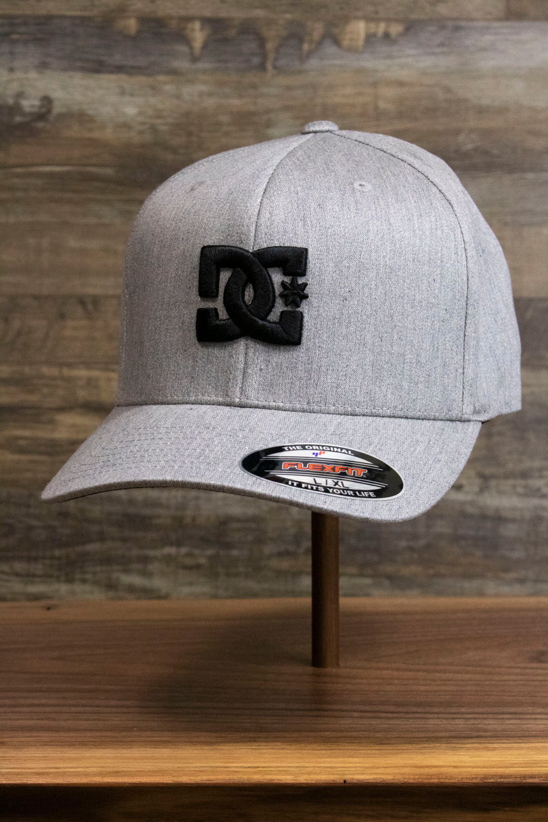 the Light Gray Bentbrim Skater Hat | DC Shoes Black Bottom Heather Gray Flexfit Cap has a bent brim and a flex fit