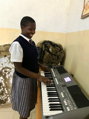 Spoolies donation, keyboard for girls high school in Kitale Kenya with Sr. Freda