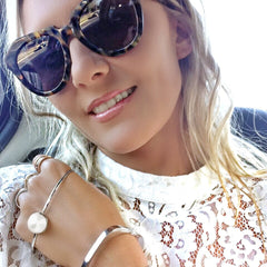 Olivia Wagner Global Swarovski PR wears Sarina Suriano Lustrous Oculous pearl palm cuff