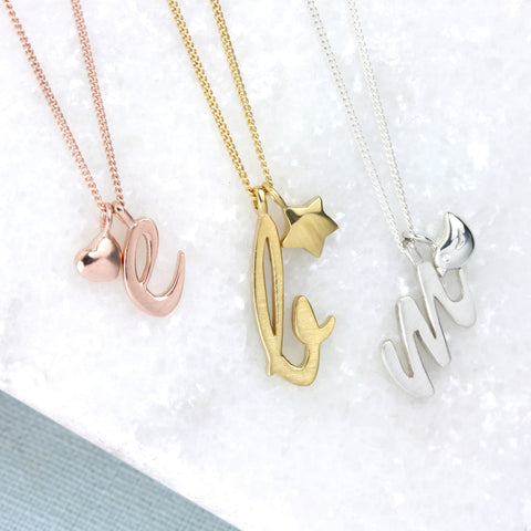 Letter pendants with heart, bird and star charm