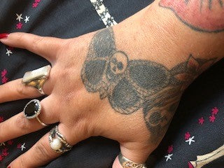 Emma butterfly skull tattoo