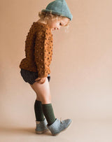 Baby wearing knee socks and grey Glerups Wool Baby Boots