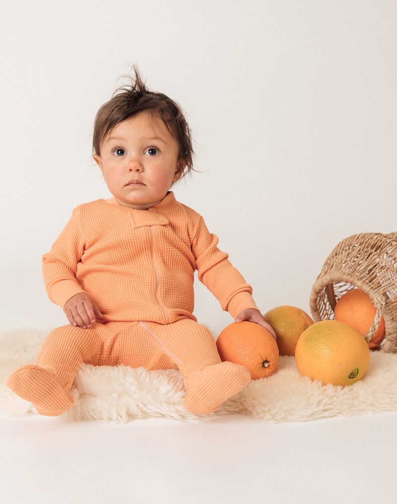 Noble Organic Waffle Footie Sleeper in Creamsicle