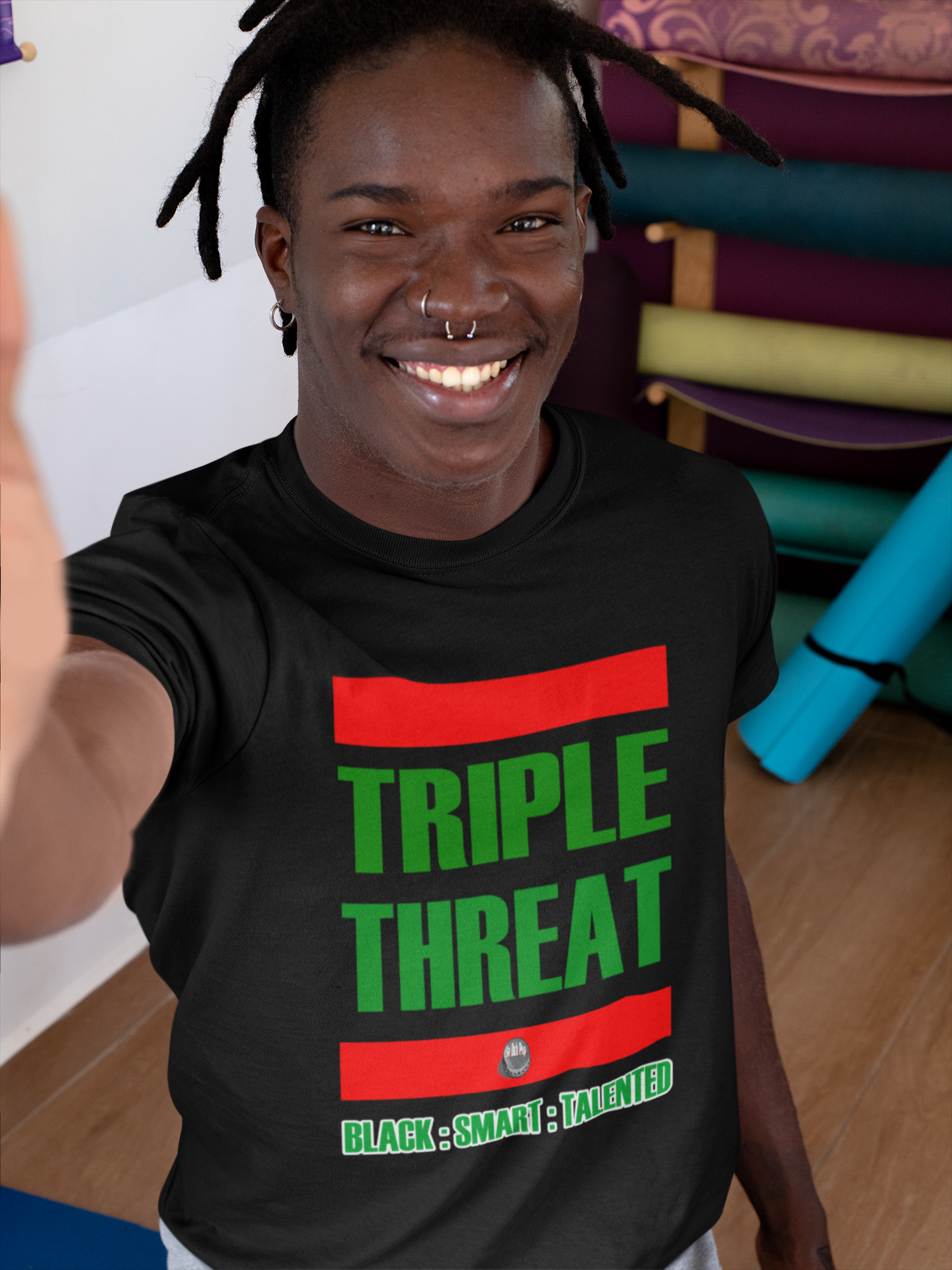 T shirt mockup of a man taking a selfie at a yoga studio 31107