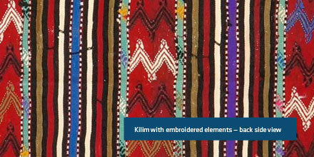 Kilim with embroidered elements have a more unfinished backing