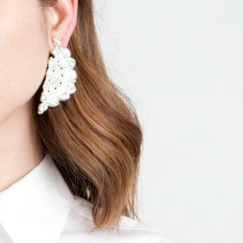 Randal in silver earrings by Alexandra Koumba