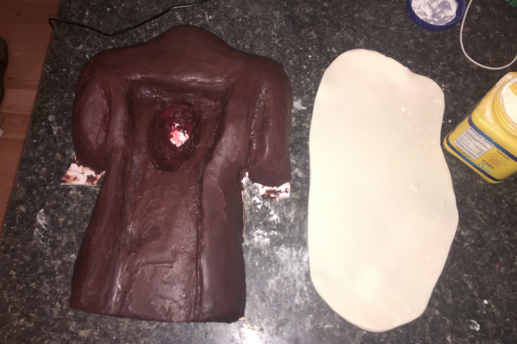 Torso cake prepping for organs