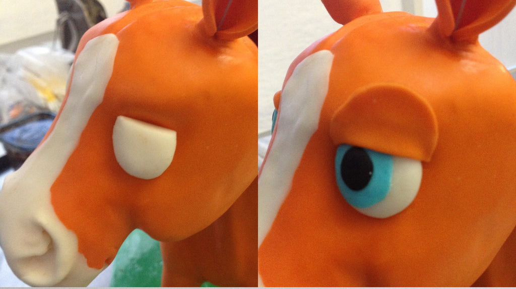 Finishing touches on a pony cake