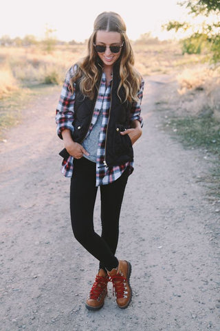 Hiking Boots Styled with a Flannel Shirt, Leggings, and a Warm Vest