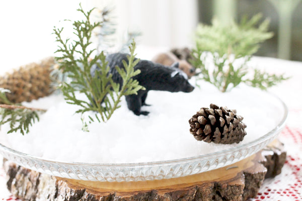 fake snow bear and beaver greenery christmas decorations middle of table