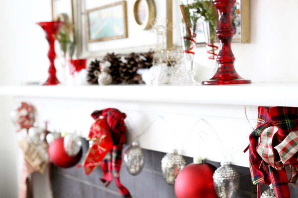 fireplace decorations red bows and lights and red balls