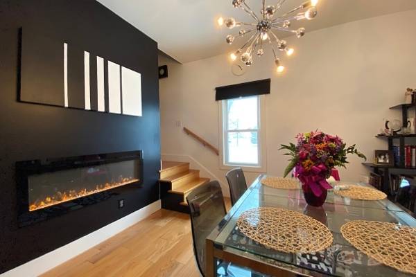 Long linear fireplace in a dining room