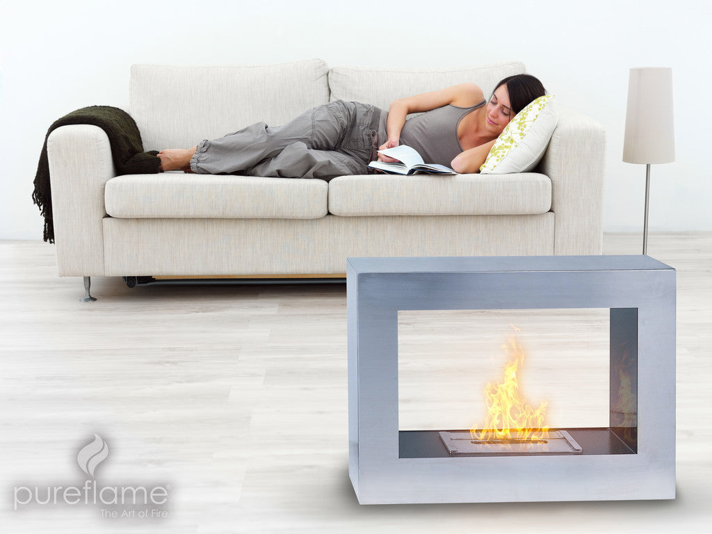 Two sided freestanding fireplace by the couch