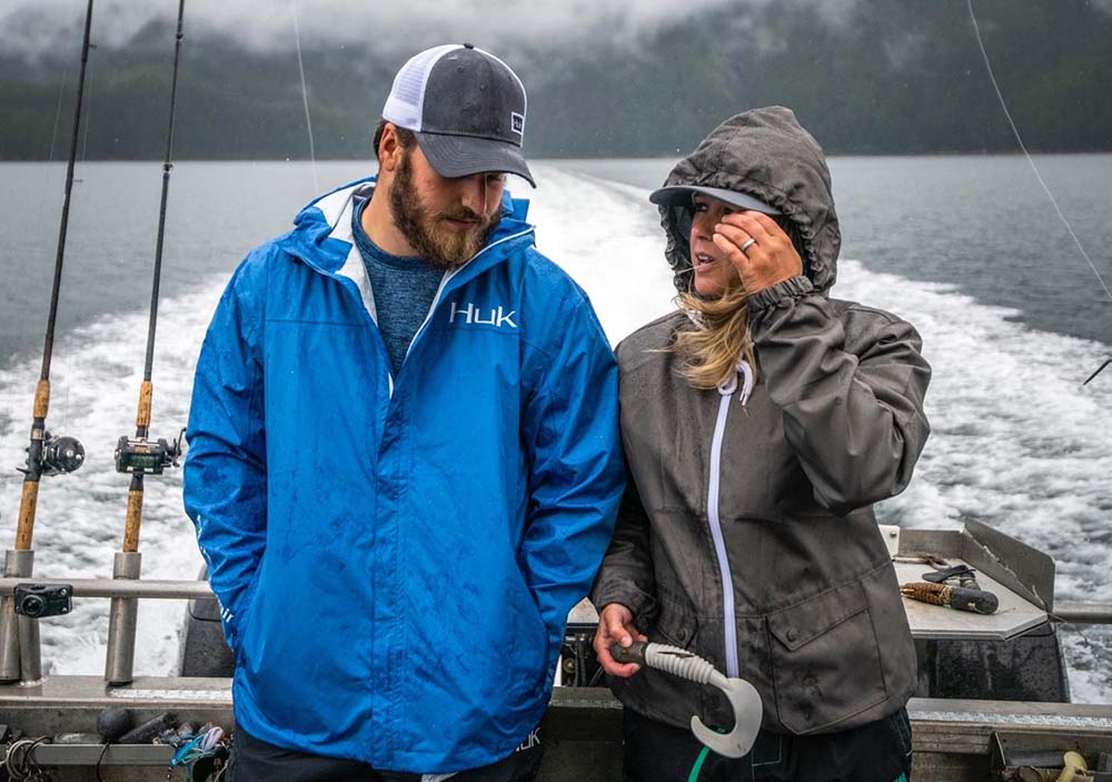 couple wearing huk fishing jackets
