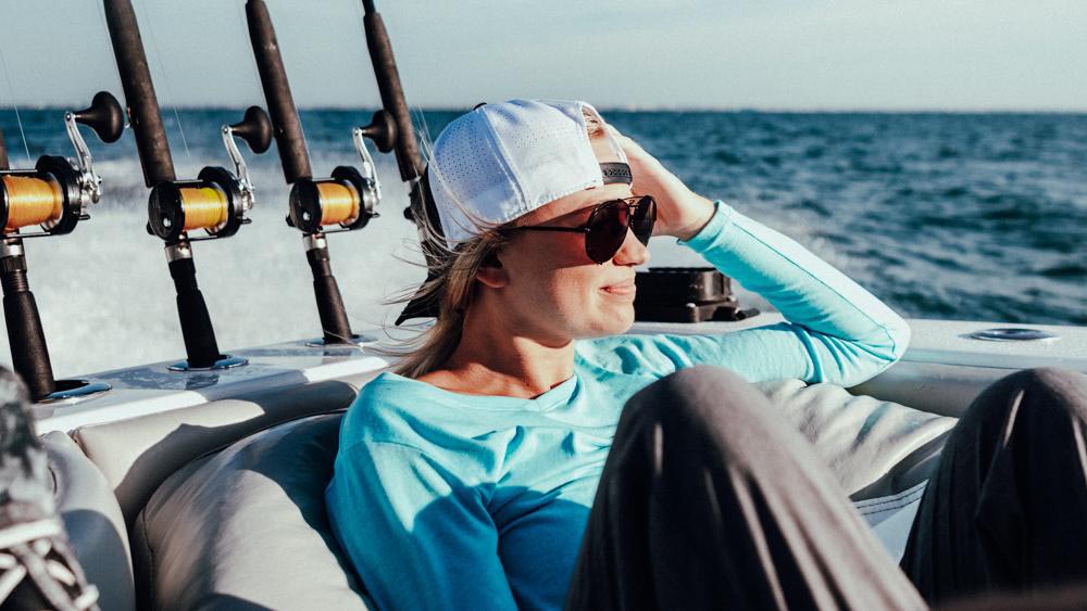 woman on boat looking at ocean