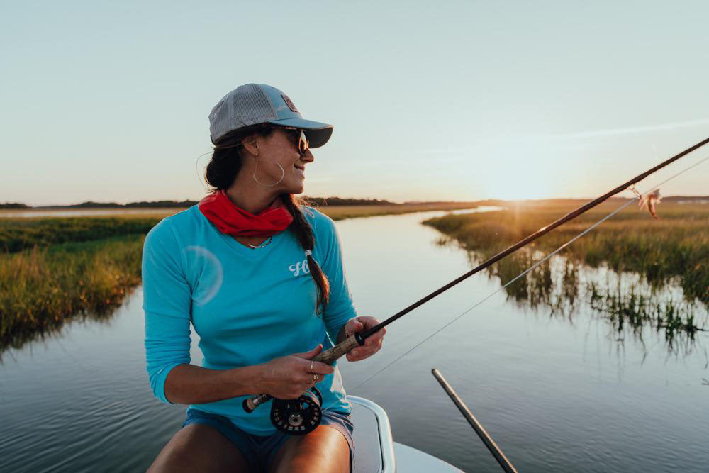 woman wearing long sleeved huk shirt