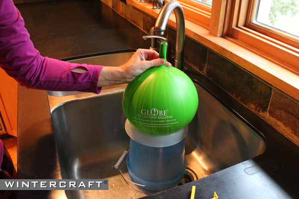Release excess air from the Wintercraft Globe Ice Lantern Balloon