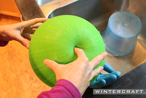 Push finger into the Globe Ice Lantern and pinch thumb and index finger together to determine thickness of ice