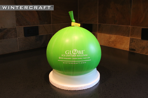 Place the water-filled Wintercraft Globe Ice Lantern Balloon in the Freezing Base on the Insulation Disk