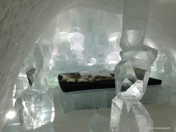 A room in the Ice Hotel filled with stacked ice chunks to resemble Cairns or Inuksuks.