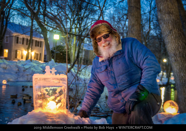 Dale Hammerschmidt posed by Mary Arneson's Ice People lantern 2019 Middlemoon Creekwalk Photo by Bob Hays Wintercraft