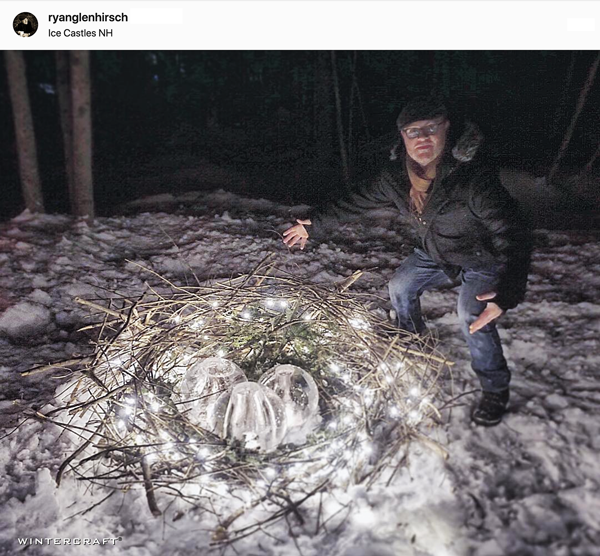 Man with nest of globe ice lanterns