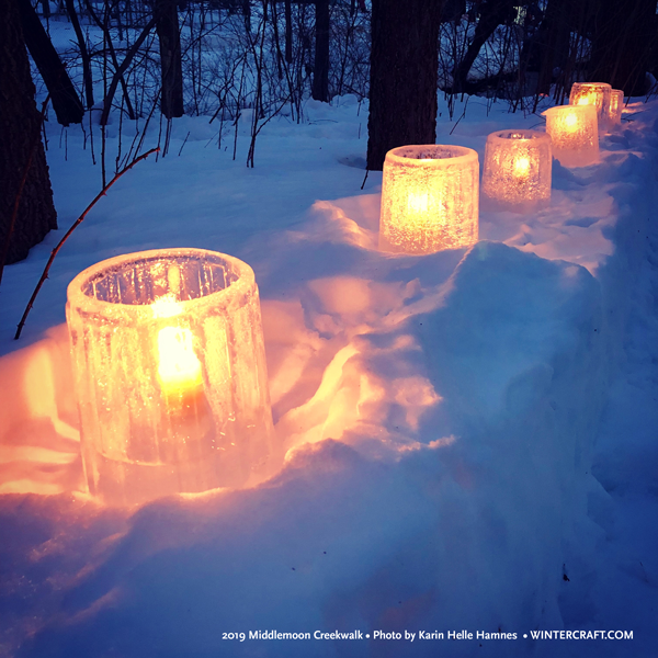 Textured bucket ice lanterns lined the walkway at 2019 Middlemoon Creekwalk ice by Mary Arneson photo by Karin Helle Hamnes