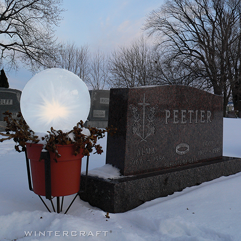 Wintercraft IceLantern - Globe Ice Lantern on display by memorial 