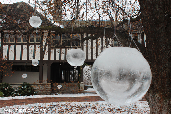 Globe Ice Lanterns hanging in a tree!