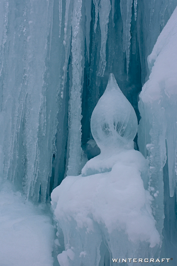 Jennifer Shea Hedberg Wintercraft Teardrop Ice Lantern in wall of New Hampshire Ice Castle 