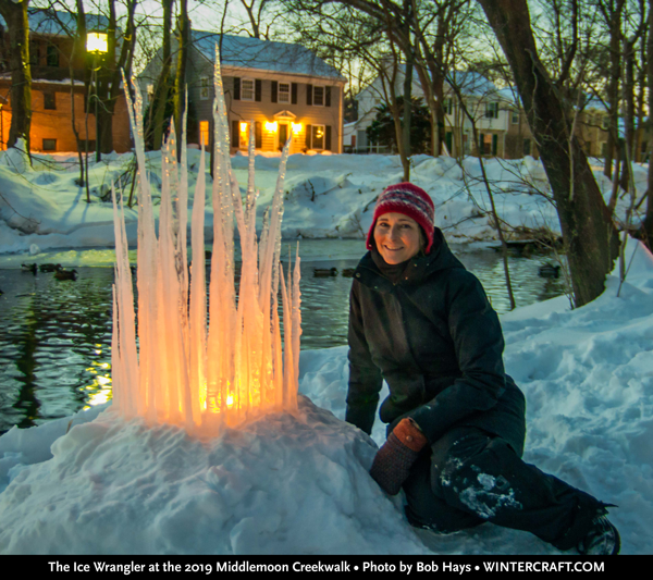 The Ice Wrangler, Jennifer Shea Hedberg posing next to an Icicle Castle at the 2019 Middlemoon Creekwalk