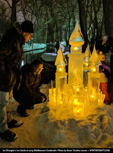 People looking at the 2019 ice castle by Jennifer Shea Hedberg Ice Wrangler Middlemoon Creekwalk photo by Karen Tischler Larson 