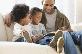 African American Father Reading to Children