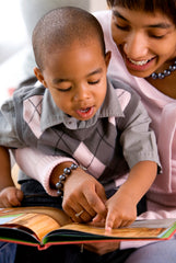 African American Parent Reading to Child