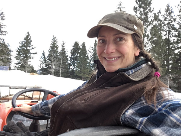 Julia on the tractor at Blue Sky Ranch