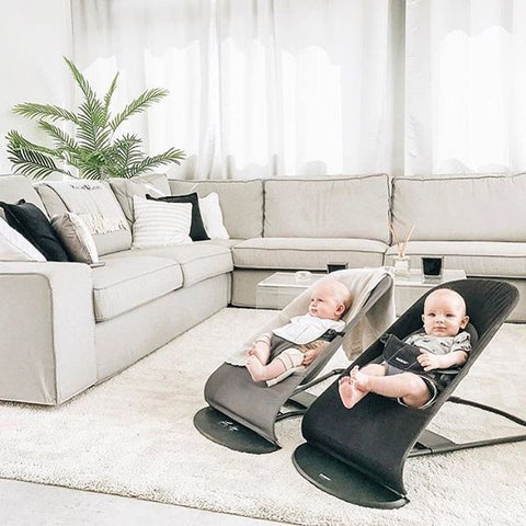 Two newborn babies in Baby Bjorn bouncers