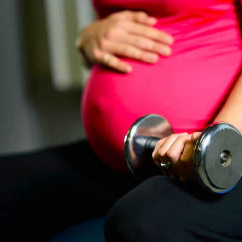 pregnant woman lifting weights